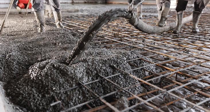Concrete floor being poured on a building site