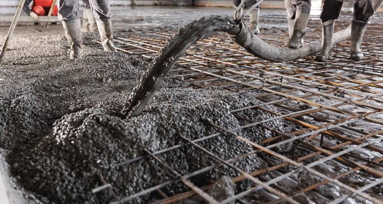 Concrete floor being poured on a building site