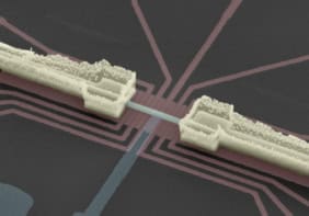 Microscope image of two quantum dots connected by a superconducting wire. Other circuitry elements are also visible on the chip.