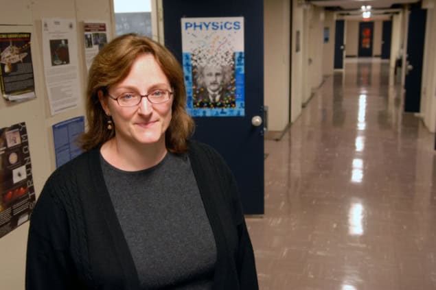 A woman standing in a corridor