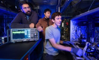 Stanford researchers measure an optical amplifier chip in the lab