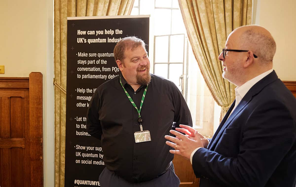 Dave Robertson speaking with Steve Yemm in the UK parliament building