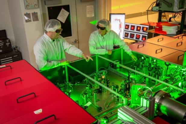 Two researchers working at the BELLA Center