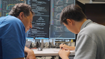 Two people working in finance