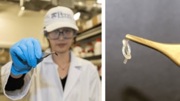 researcher holding a tiny knotted robot with tweezers