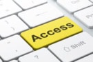 Computer keyboard with a gold button labelled Access