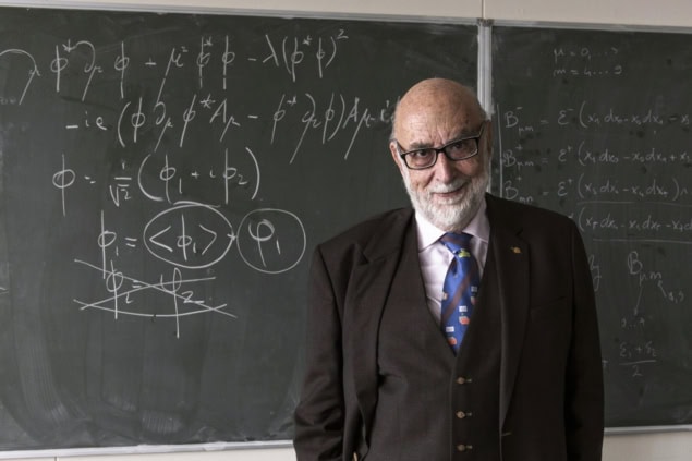 François Englert standing by a blackboard