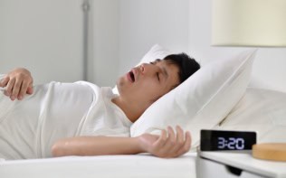 Man asleep and snoring