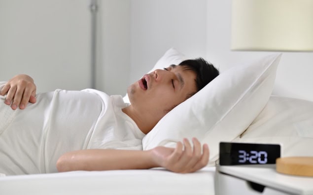 Man asleep and snoring