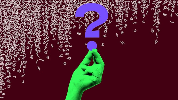 Falling letters of English language with a hand and a question mark
