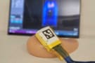 A 3D ultrasound probe positioned on a tissue phantom