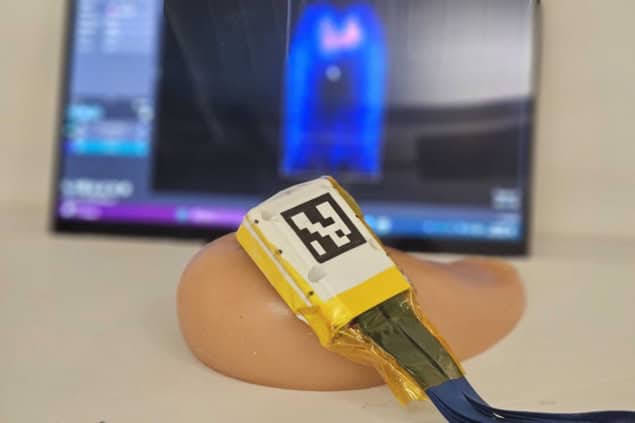 A 3D ultrasound probe positioned on a tissue phantom