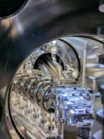 Photo of the inside of the vacuum chamber where the experiment takes place, showing equipment used to steer the molecules