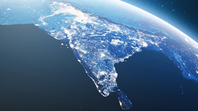 Earth from space with India lit up with lights in the night