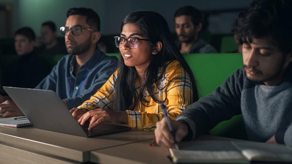 Indian students taking notes during lecture