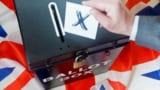 Photo of someone casting a ballot