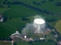 Aerial view of Jodrell Bank Observatory, surrounded by fields and hedges