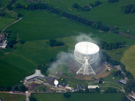 Aerial view of Jodrell Bank Observatory, surrounded by fields and hedges